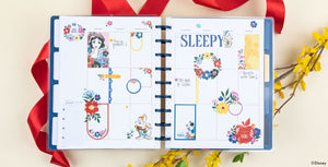 Image of a Happy Planner Disney Snow White planner open with Snow White stickers