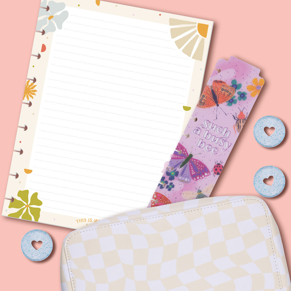 Image of Happy Planner Accessories including filler paper, bookmarks, sparkle blue discs and a checkered zip folio